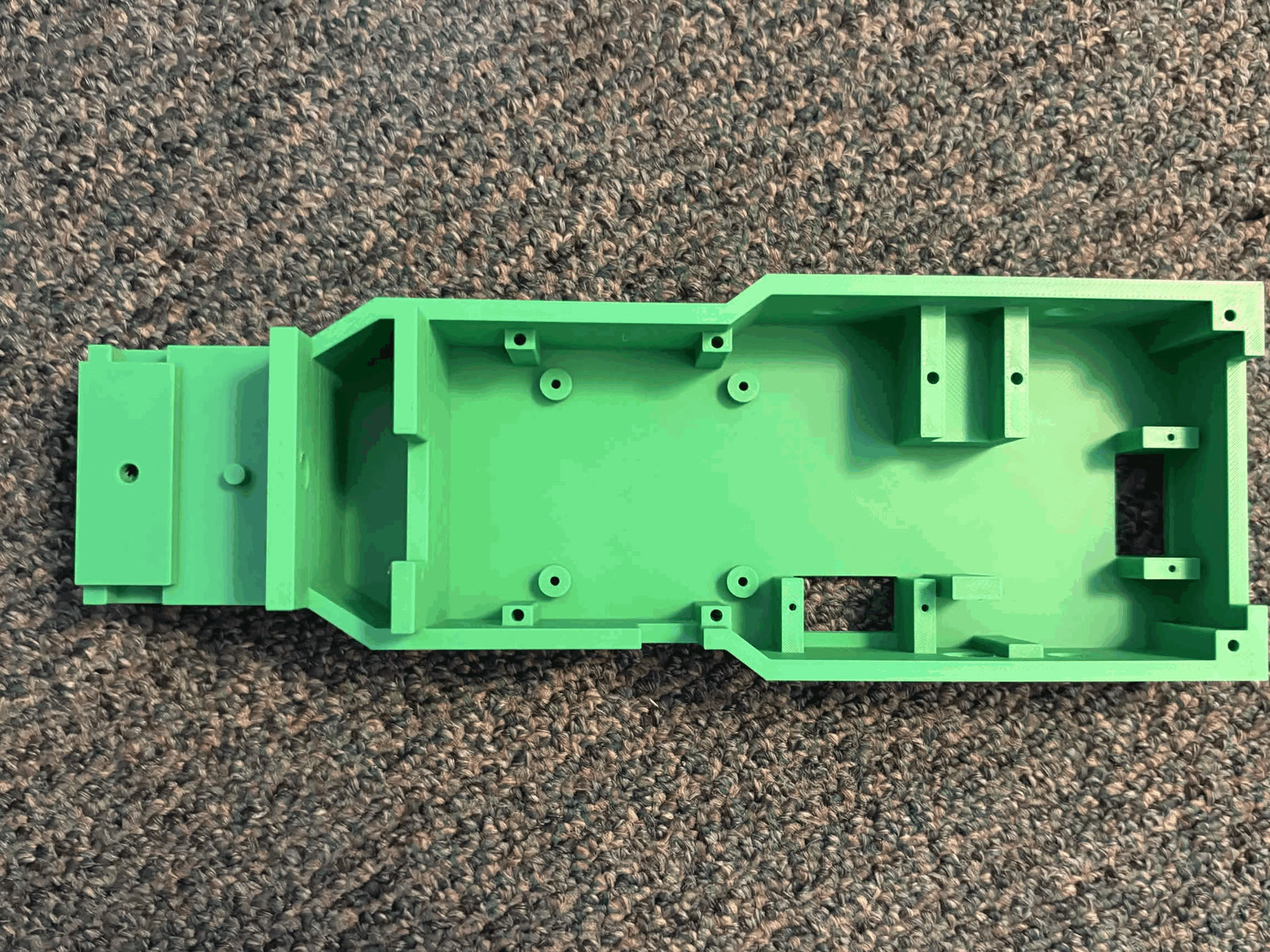 FDM printed green PLA V2 chassis with mounting bosses and electronics bay