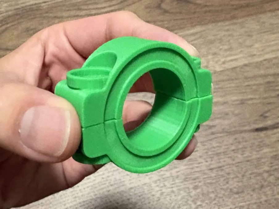 Green printed shaft collar held in hand